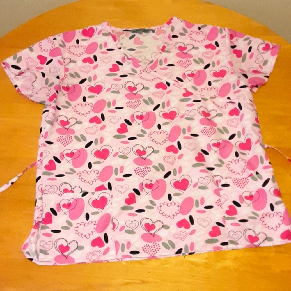 Pink and white scrub top